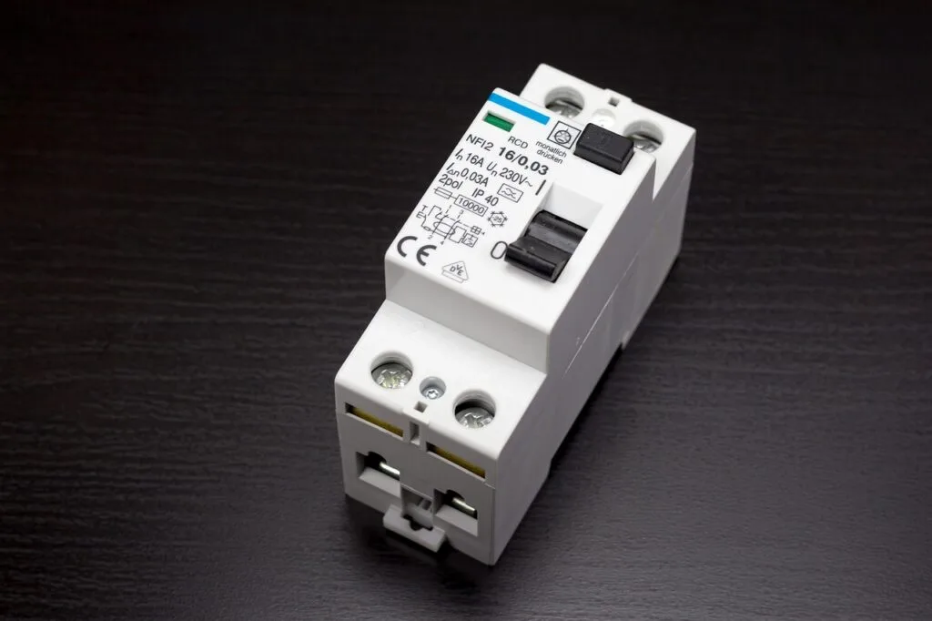 Circuit Breaker-The Power of Circuit Breakers Close-up of a circuit breaker with electrical wires connected, ensuring safety and preventing electrical overload